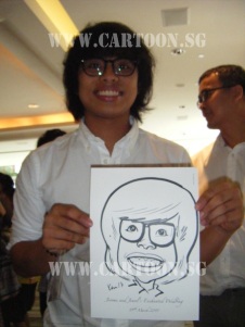 Happy Guest holding his caricature done by Cartoon.sg